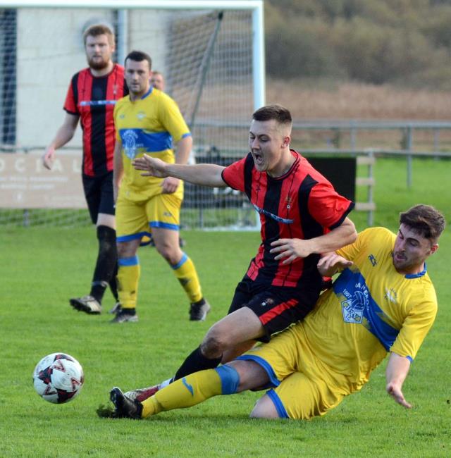 Two-goal cup hero Rhys Jones on the end of a strong tackle against Seaside. Picture Gordon Thomas